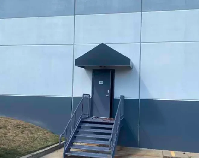 Small black awning installed on back door of commercial establishment in Eatontown, NJ